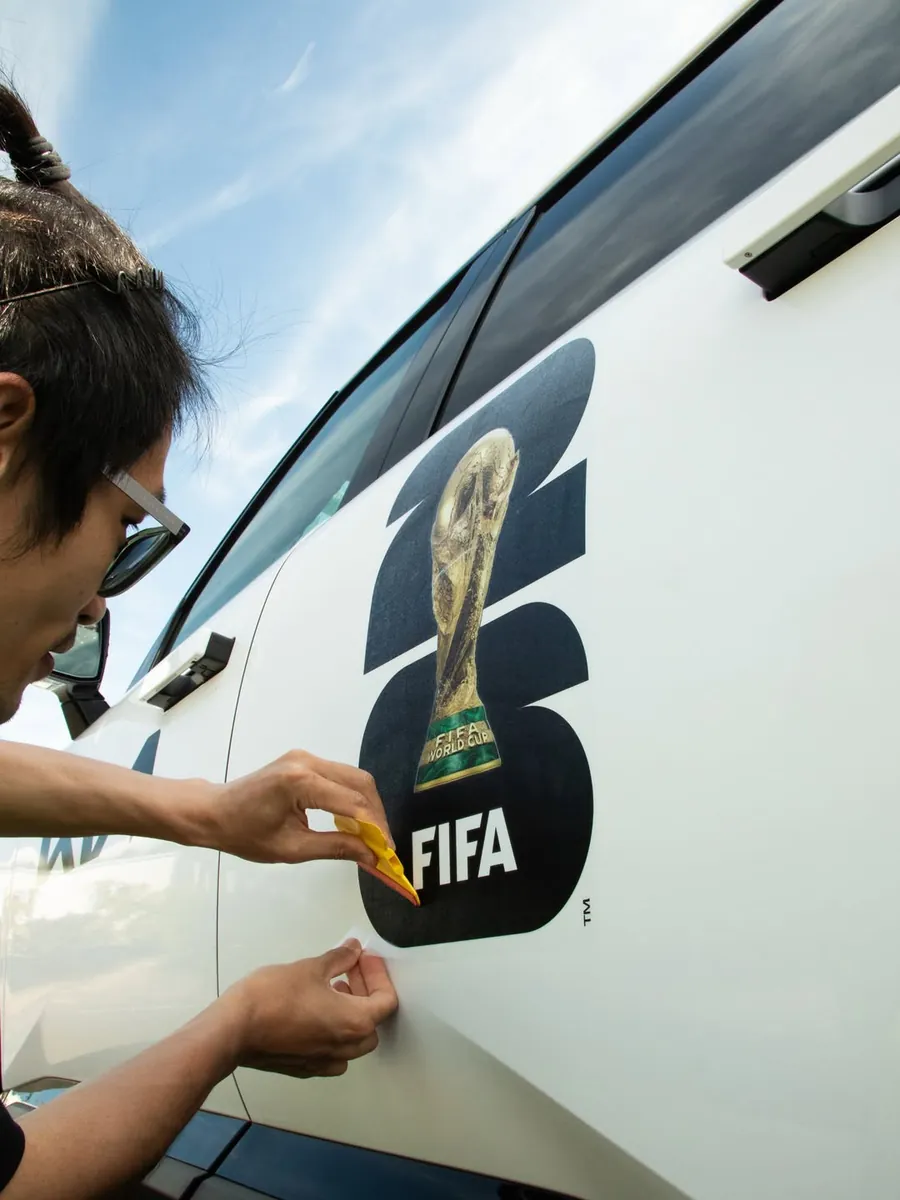 Installing FIFA World Cup 2026 graphics on a Kia fleet vehicle