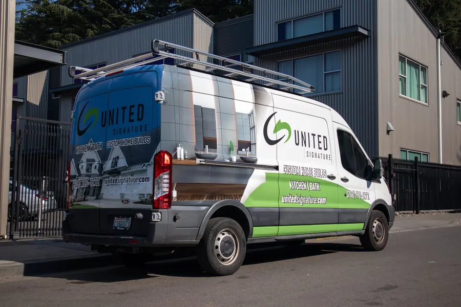 White cargo van with green and blue United Signature fleet graphics