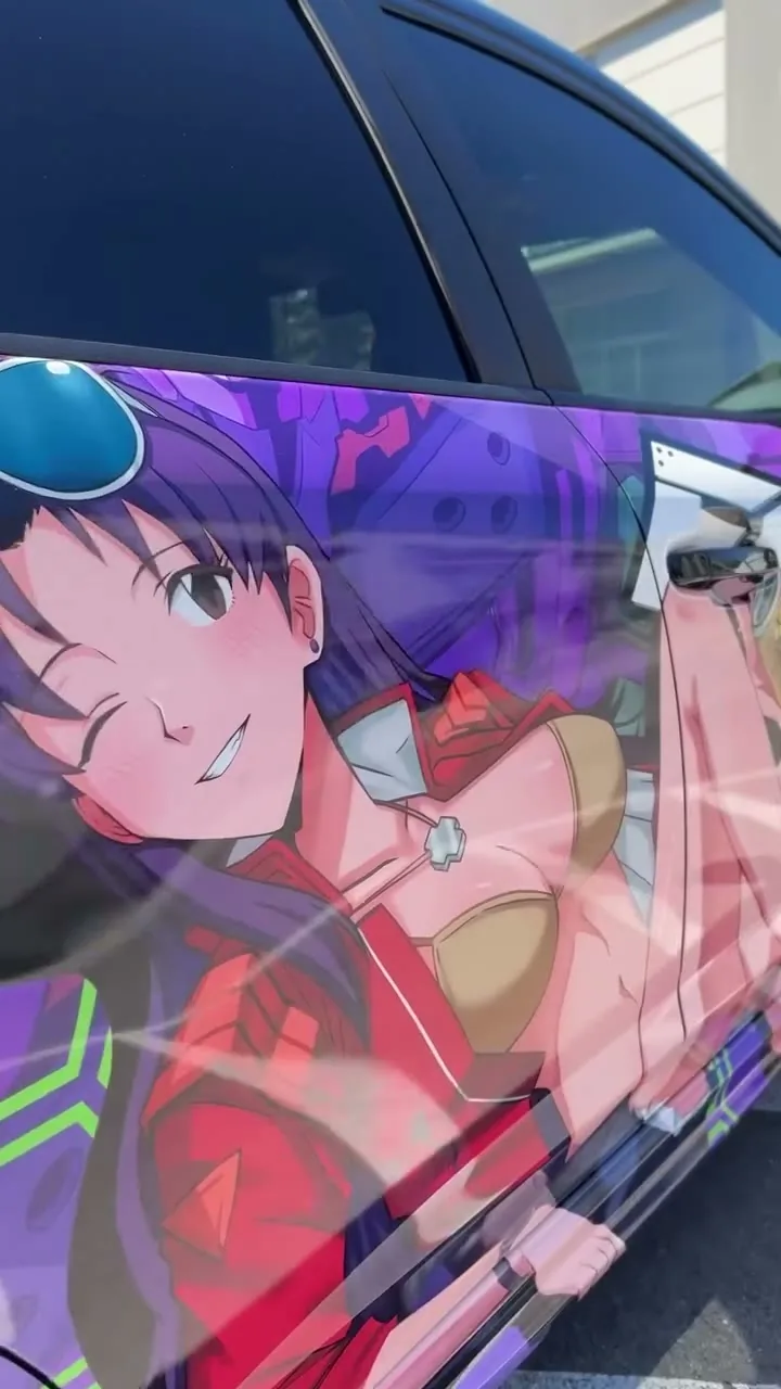 Misato Katsuragi Evangelion itasha in purple and green on a Subaru Impreza
