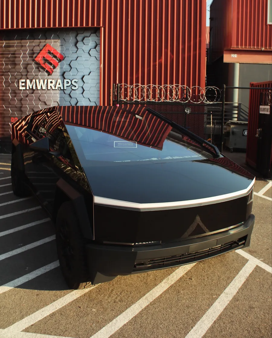 Tesla Cybertruck in gloss black color PPF in front of the EMWRAPS door
