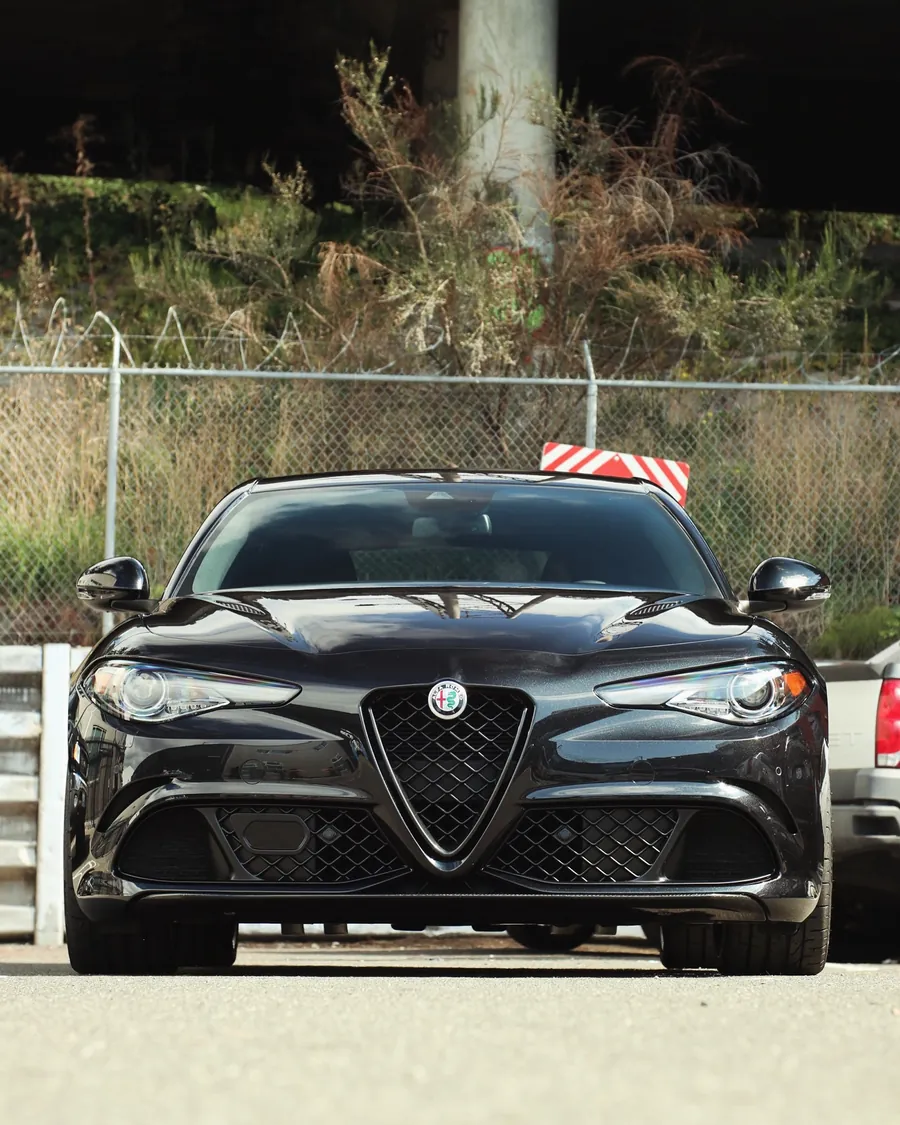 Black Alfa Romeo Giulia Quadrifoglio with full body gloss PPF, front view