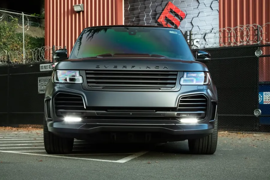Overfinch Range Rover in full body stealth PPF in front of the EMWRAPS shop
