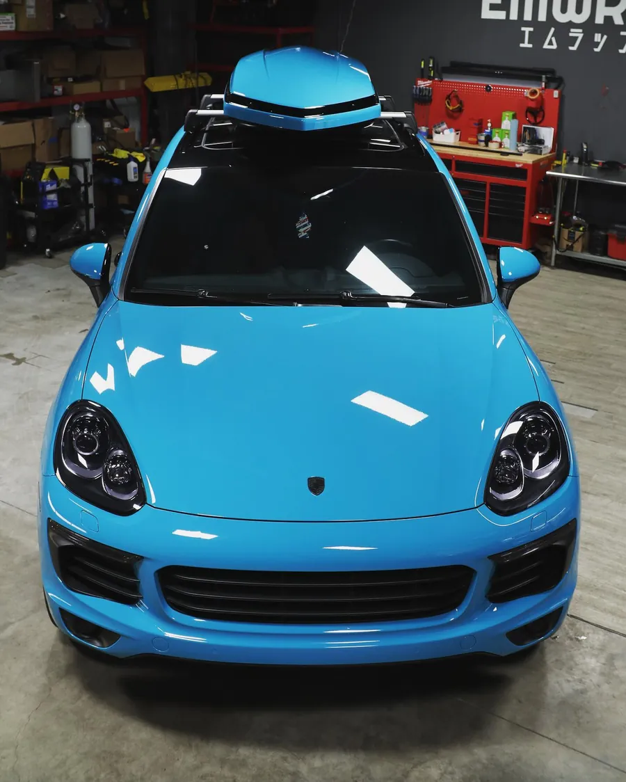 Porsche Cayenne wrapped in Miami Blue