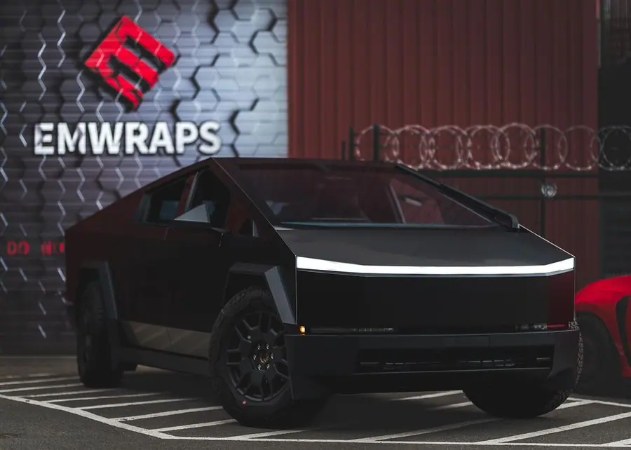 Tesla Cybertruck wrapped in satin black outside the EMWRAPS shop