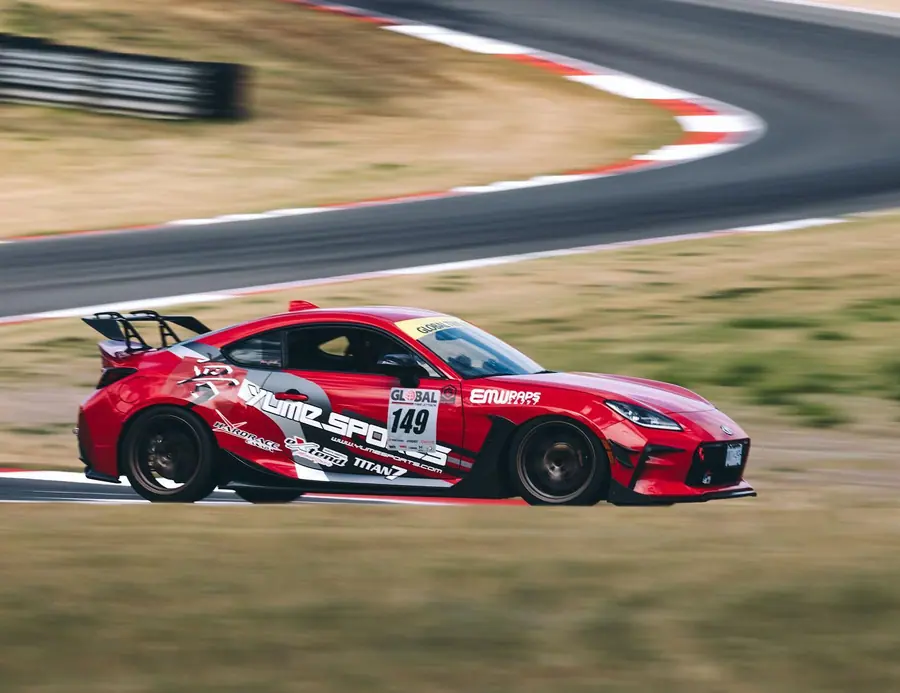 Toyota GR86 time attack car in a custom race livery on track